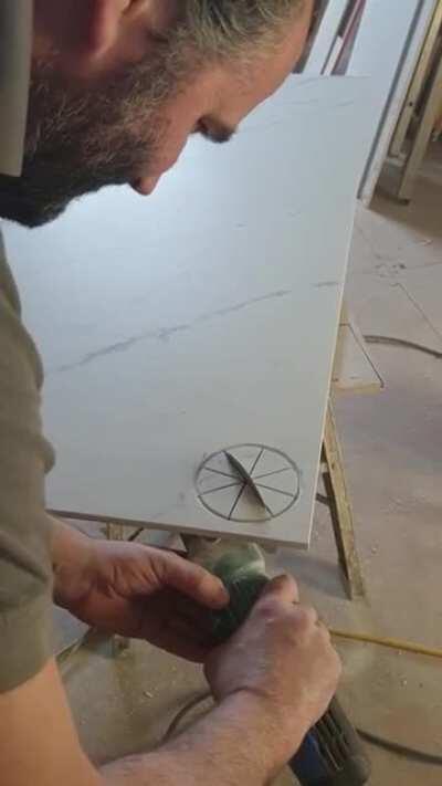 Missed the beginning but heres a tiler cutting a hole