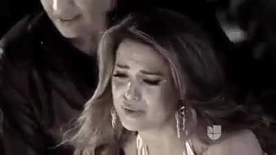 Latina models on a reality show are forced to walk on hot coals