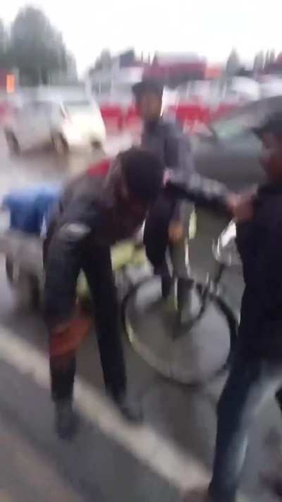 a man being harassed for carrying liquor in public