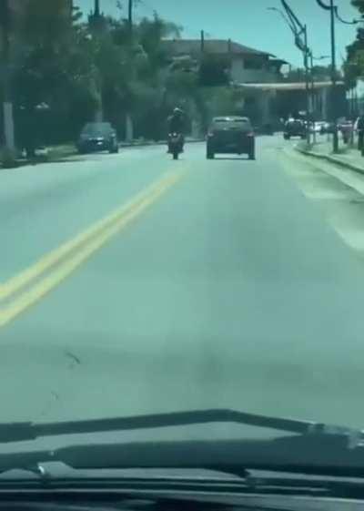 Car kicking biker gets wrecked