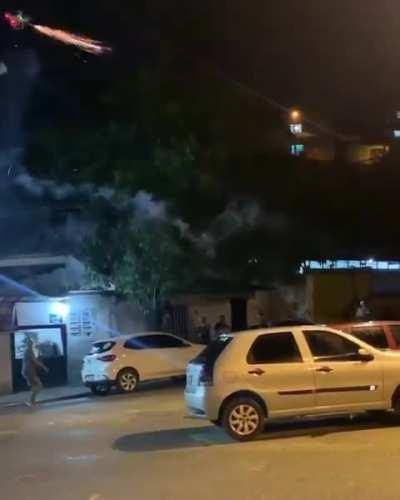 Man shoots fireworks from his drone towards a crowd of people that refused to turn down their music