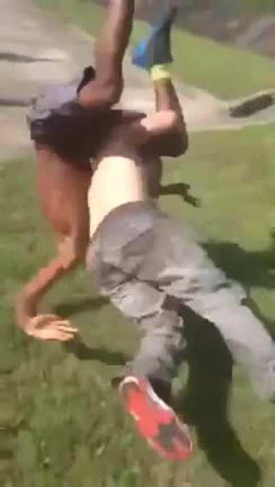 Sucker punch failed, starts to get whupped, saved by his friend.