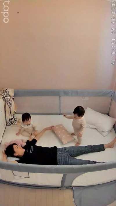 A tired mother's reaction to her baby's first steps