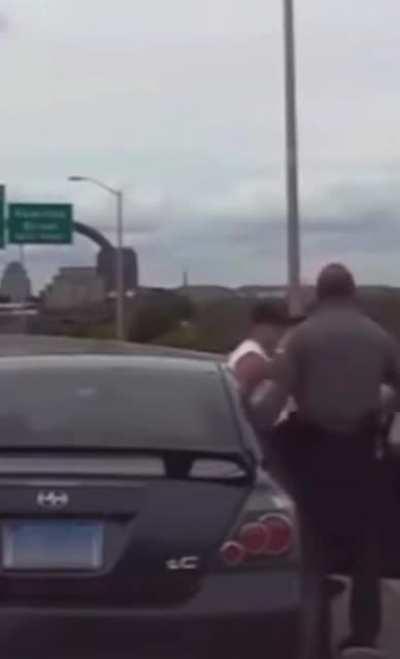 Cop loses it on the side of the highway