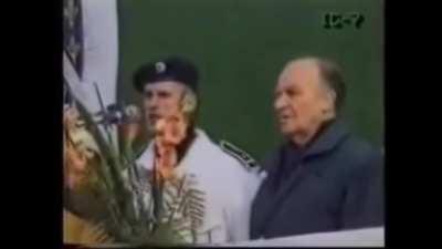 Bosnian kindergarten kids singing the national anthem before school entrance