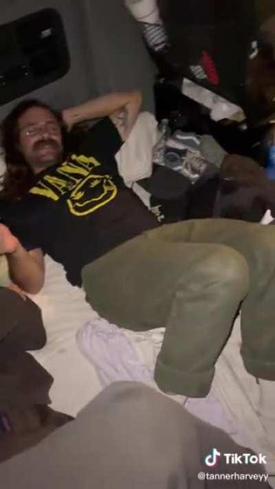 Guy shows his party trick to his friends