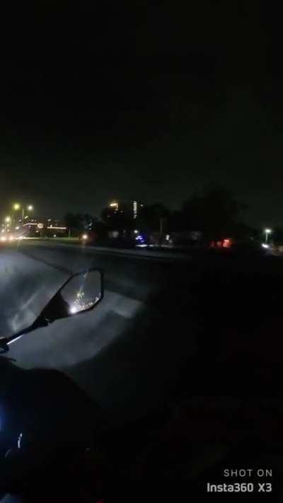 Standing in the middle of an highway.