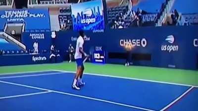 Djokovic the moment after inadvertently hitting a ball and striking a line judge in the neck