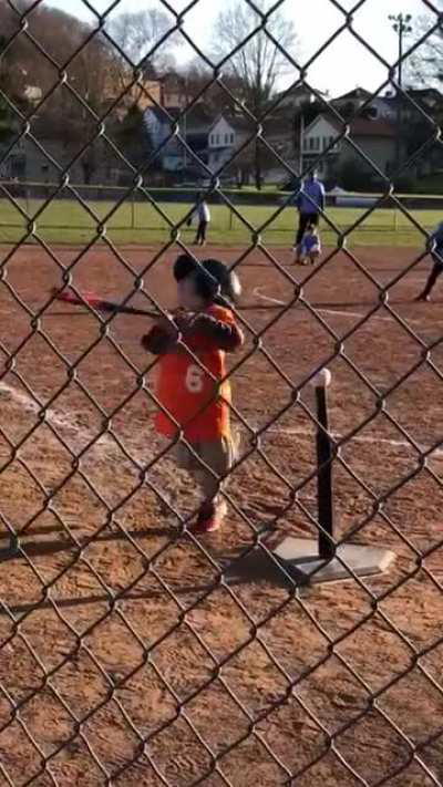 Adorable young baseball player takes a crack at the ball