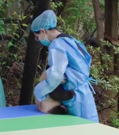 Comforting a baby panda