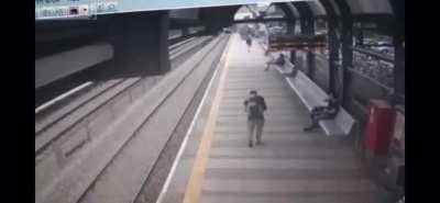 Train platform turned into a bowling alley by suicidal man.