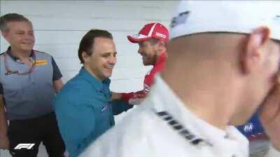 Sebastian Vettel pretends to get an electric shock from shaking Felipe Massa's hand, Brazil 2018