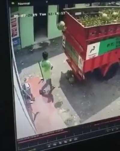 man throwing propane tanks