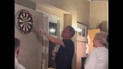 nan playing darts
