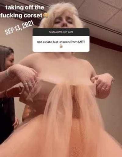 Billie Eilish bending forward and exposing her massive tits