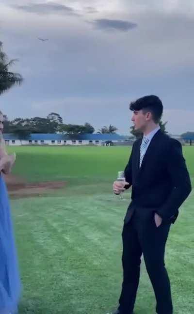 Long distance girlfriend secretly flies in and shows up for his prom.