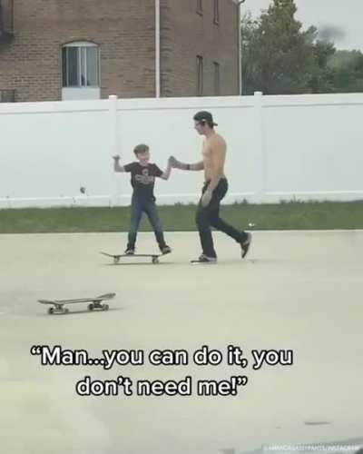 Big skate dude teaches little skate dude