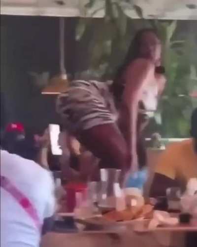 Women twerking at a restaurant
