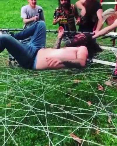 Jumping on barbed wire trampoline