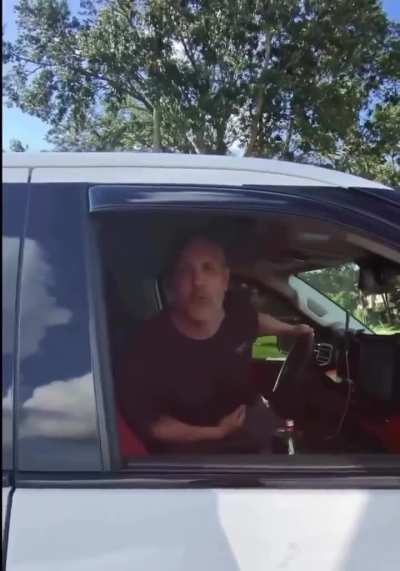 Male Karen in a pickup truck confronts a young man going the speed limit on his motorcycle