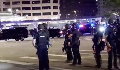 Denver. Police were firing pepper bullets and tear gas at cars stopped at an intersection, targeting a car with a pregnant woman. A man yells at them “You’re shooting my car with my girlfriend in it? My pregnant girlfriend in it?” The cops open fire