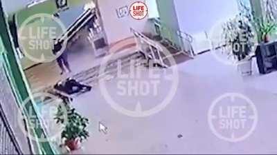 CCTV. Policeman shoots the Perm shooter.