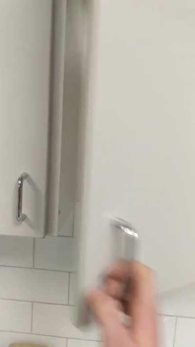 This cupboard at my work. I guess they just ran out of shelves...