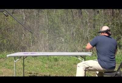 Gun explodes as guy tried to fire it. Keep in mind that this guy was hit by a piece at around 85,000psi of pressure. That could rip a person to shreds. Dude is lucky to be alive