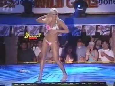 Torrie Wilson doing a strip tease