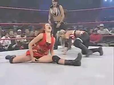 Christy Hemme taking herself out from the turnbuckle