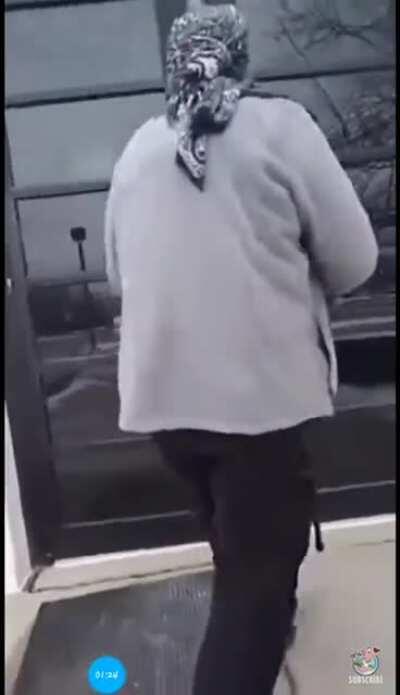 Man walks into police station, wearing a mask, and carrying an assault rifle.