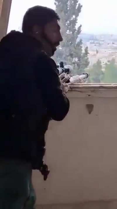 SDF marksman firing a craft-made Zagros anti-materiel rifle at SNA forces near Manbij, Syria