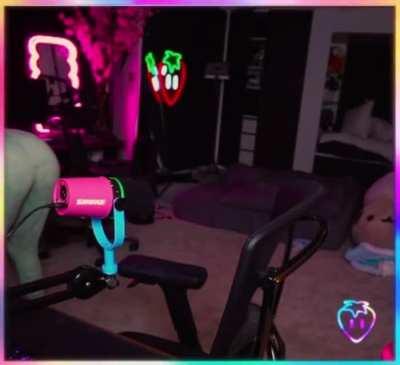 Bending over to pet her cat during 24 hour stream