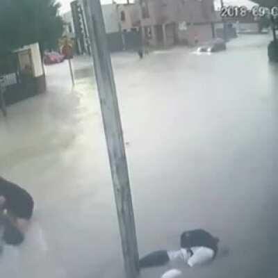 DoV touching a stop sign during a hurricane