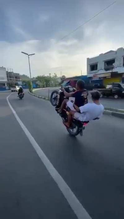 WCGW doing wheelie on a public road.
