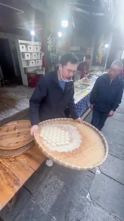 Dumpling flipping magician