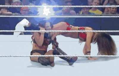 The Boss between Nikki Bella's thighs