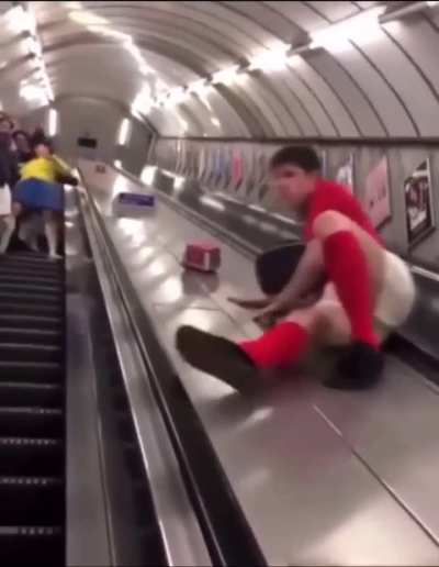 Sliding down an escalator
