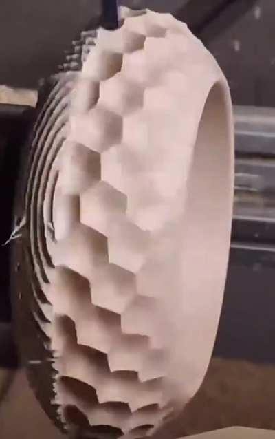 Carving a geometric patterned bowl out of a block of wood. 