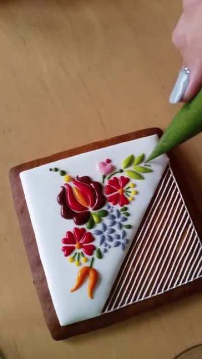 Embroidery style icing on a cookie