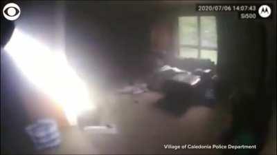 Officer rescuing good ol boi from house fire