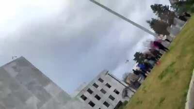 Trump supporter lunges towards journalist, causing him to fall to the ground, at the Oregon Capital building protests.