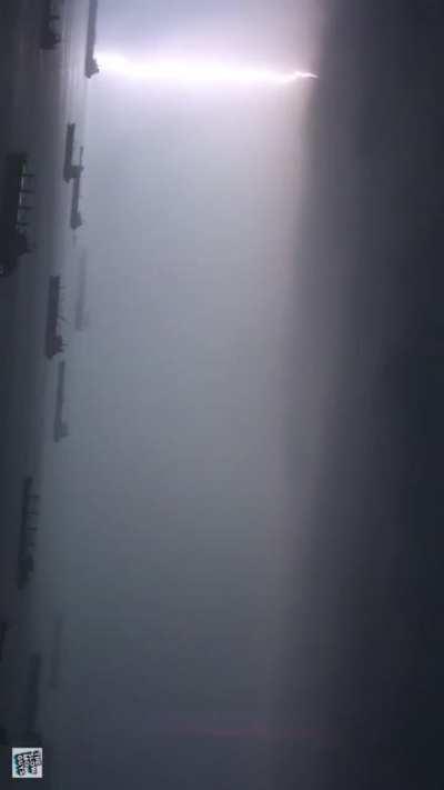 How lightning seeks for somewhere to strike and lights up the entire bay, revealing the boats.