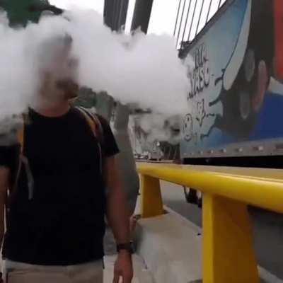 Smoking beside a moving truck