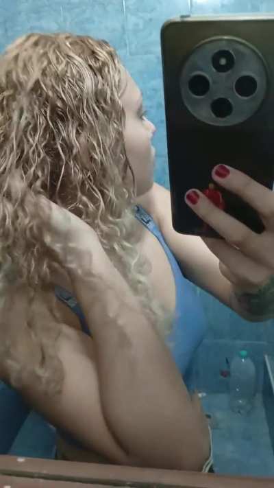 I went into a bathroom to show how beautiful and captivating my golden curls are.