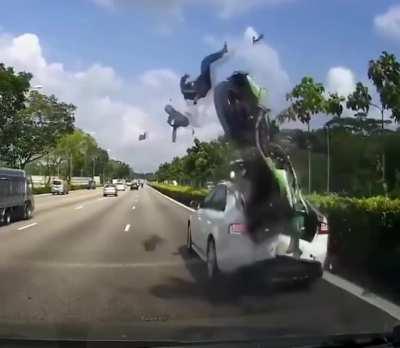 motorcycle crashes into a car