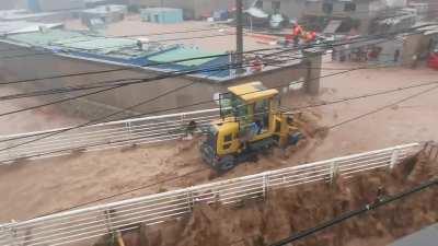 Gigachad in a tractor loader risk his life saving a family of 3 stuck in a fast moving raging flood