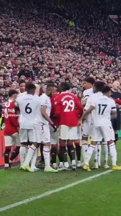 Casemiro and Will Hughes hugging post-tussle.