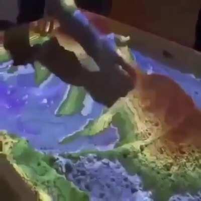 This Augmented reality sandbox allows you to interact with topographic maps