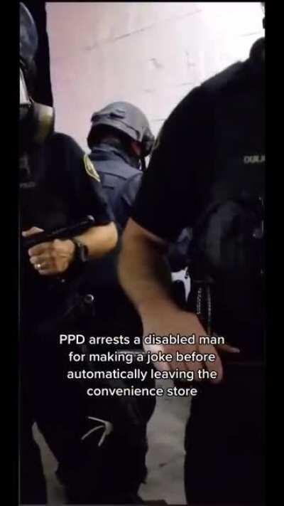 Cop manhandling a handicapped guy